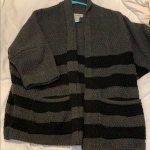 Grey cardigan with black stripes at bottom